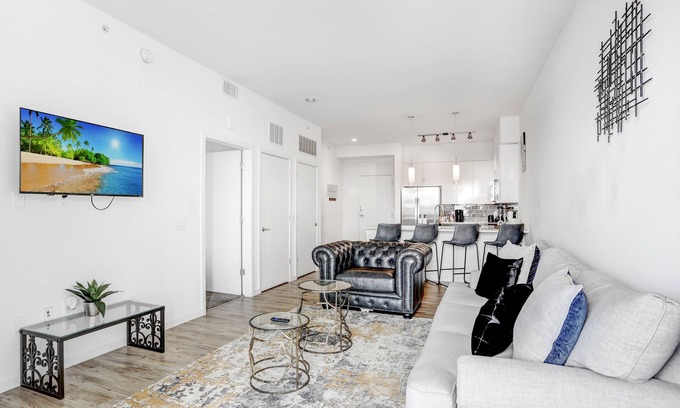 Channel District Apartment | Indulge in a City View Sky Lounge & Top Gym Access