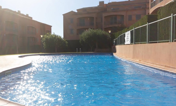 L Almadrava Apartment | Relax at INNOUTHOME: Poolside Comfort & Free WiFi