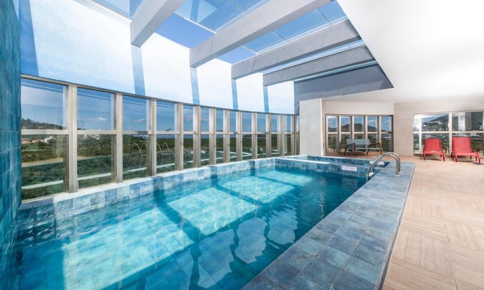 Saco Grande Hotel | Discover Intercity Portofino Florianópolis: 4-Star Oceanfront Stay