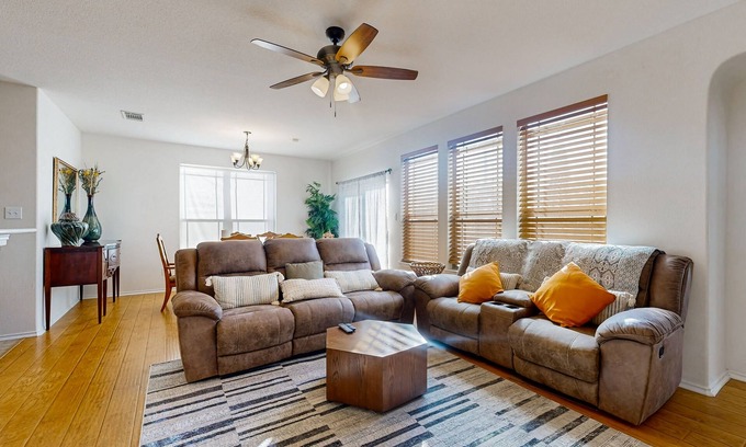Round Rock House | Inviting home with enclosed yard and patio area with gas grill