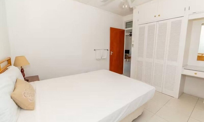 Blue Waters Hotel | Island Retreat with Full Kitchen & Scenic Views, Steps to Beach