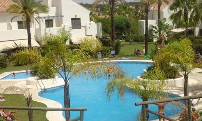 Islantilla Apartment | Relax at Islantilla Bajo con Jardin: Pet-Friendly Retreat