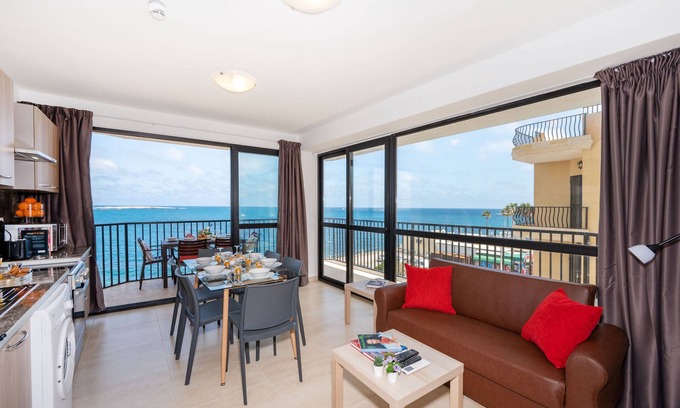 Bugibba Apartment | Seafront Apartment with Corner Terrace & Ocean Views