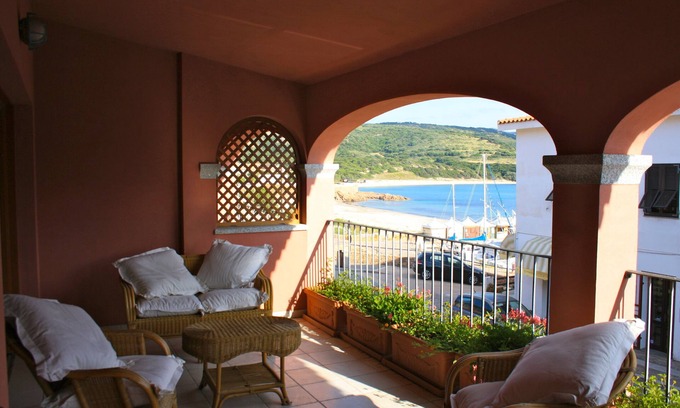 Trinita d'Agultu e Vignola Apartment | Isola Rossa Borgo Mare: Oceanfront Oasis with Spa & Pool