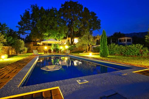 Slime Villa | Isolated Villa Terna: Garden Oasis with Pool & Ocean Views