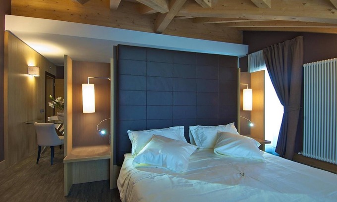 Primiero San Martino di Castrozza Hotel | Discover Hotel Garni Vittoria: 4-Star Comfort & Family-Friendly