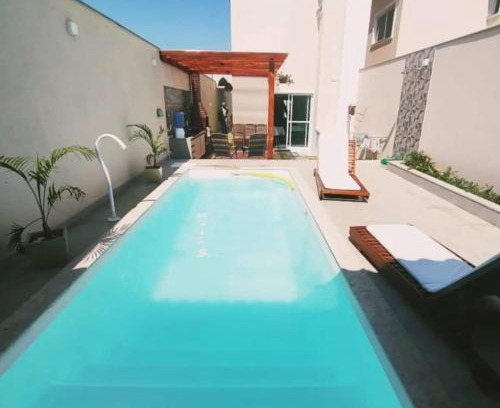 Praia do Morro House | Inviting Ivana Imoveis: Poolside Retreat Steps from Beach