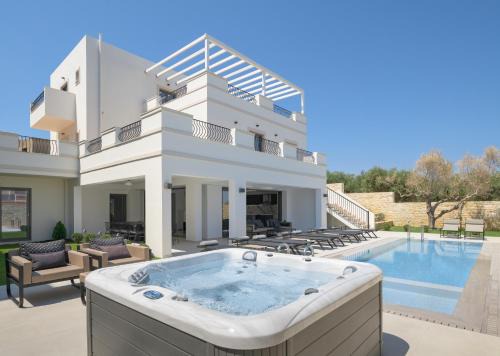 Perama Villa | Ivory Villa: Elegant Oceanfront Escape with Pool & Hot Tub