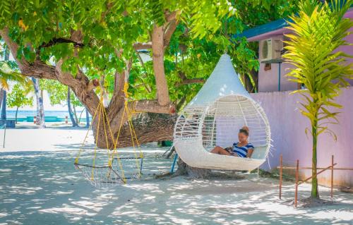 Himmafushi House | Cozy Jail Break Surf Inn: Ocean Views & Family-Friendly Stays