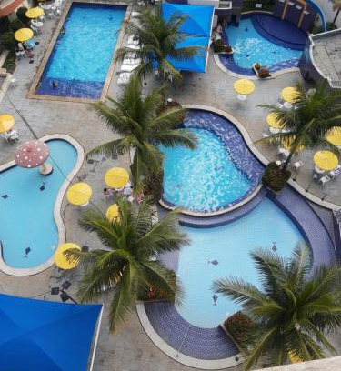 Do Turista Apartment | Jardins das Thermas: Poolside Oasis with Ocean Views