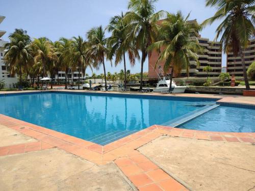 Lecheria Apartment | JB Beach Apartment: Relaxing Oceanfront Getaway with Pool