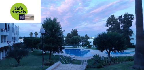 Santa Eulalia Apartment | Oura Estrela: Family-Friendly Hotel with Pool & Ocean Views