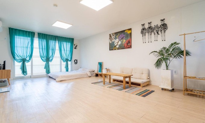 Jungmun House | Family-Friendly Jeju Dalbam Pension with Kitchen Amenities