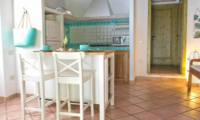 Santa Margherita di Pula Cottage | Discover Jungle House Flamingo: Family-Friendly Retreat
