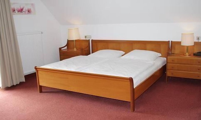 Steinbach Apartment | Relax in a Junior Suite with Balcony & Spa Amenities