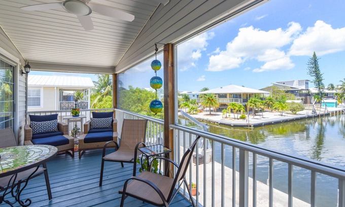 Breezeswept Beach Estates House | Idyllic Key Blessing: Your Canal Front Retreat with Dockage