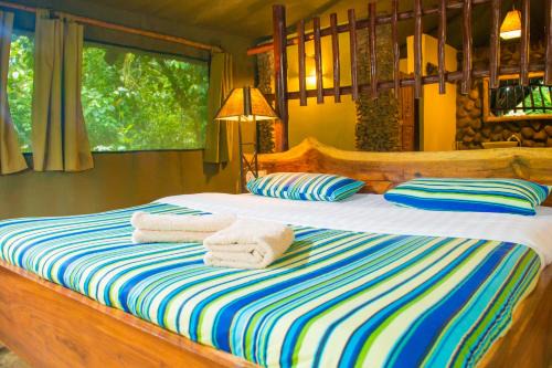 Kibale Cabin | Discover Kibale Forest Camp: Family-Friendly Retreat