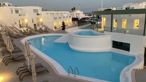 Puerto del Carmen Hotel | Oceanfront Kikere Studios: Pet-Friendly with Pool & Dining