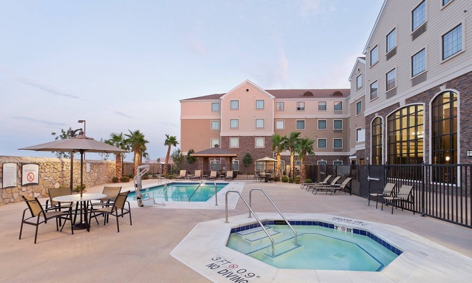 Biggs Field Condo | King Suite with Pool Access & Daily Breakfast Included