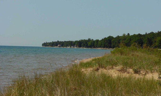 East Tawas House | Cozy Knotty Pine Cabin with Lake Huron Access & Amenities