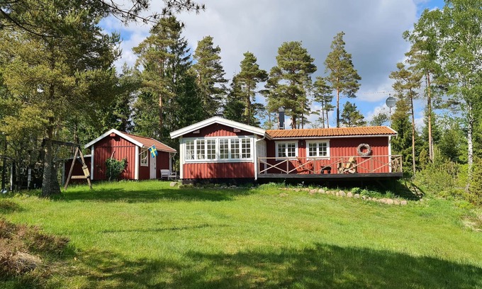 Knared House | Idyllic Krokån hus: Riverbank Retreat with Ocean Views