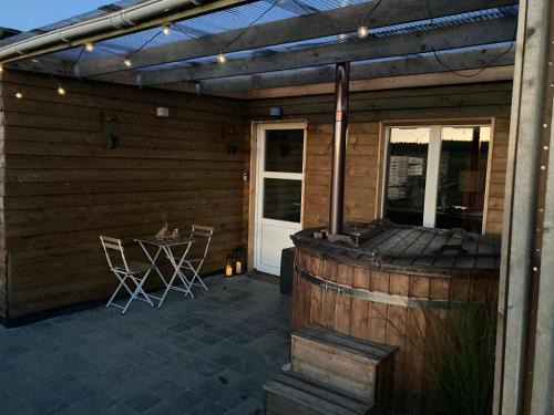 Tronquoy House | Discover L'Eddy Lodge: Pet-Friendly Retreat with Hot Tub