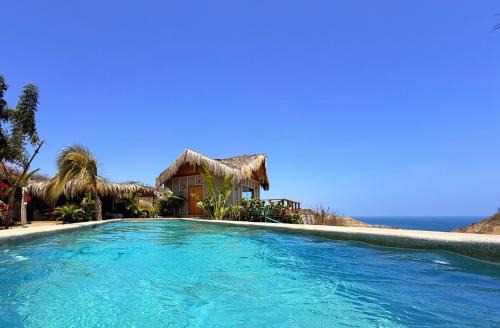 Punta Sal House | Discover La Cabaña de Iza: Oceanfront Retreat with Pool