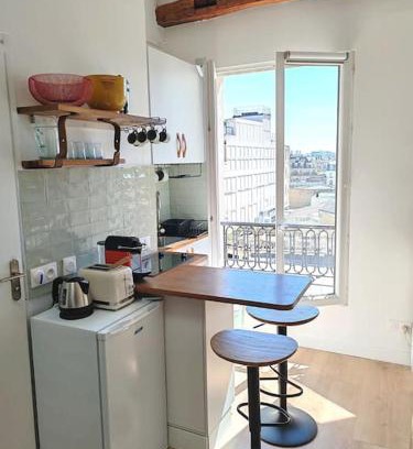 Quartier de la Porte-Saint-Denis Apartment | La Cabane Parisienne: Bright Retreat with Panoramic Views