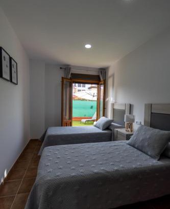 Costa Esuri Apartment | Relax at La Casa de la Encina with Oceanfront Views