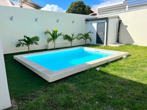 Carosse House | Relax at LA DOUBLE with Inviting Pool Amenities