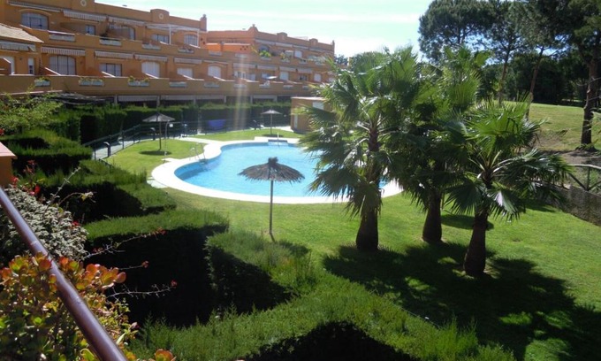 Islantilla Apartment | Discover La Hacienda: Pet-Friendly Retreat with Pool Access