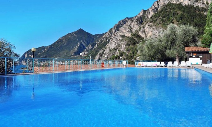 Limone sul Garda Apartment | Relax at La Limonaia: Poolside Oasis with Ocean Views
