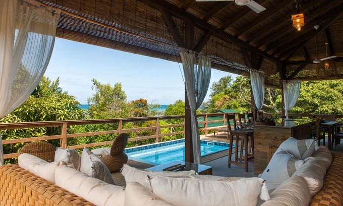 Praslin Island Ski Chalet | Cozy La Pointe Beach Huts: Family-Friendly with Pool Access