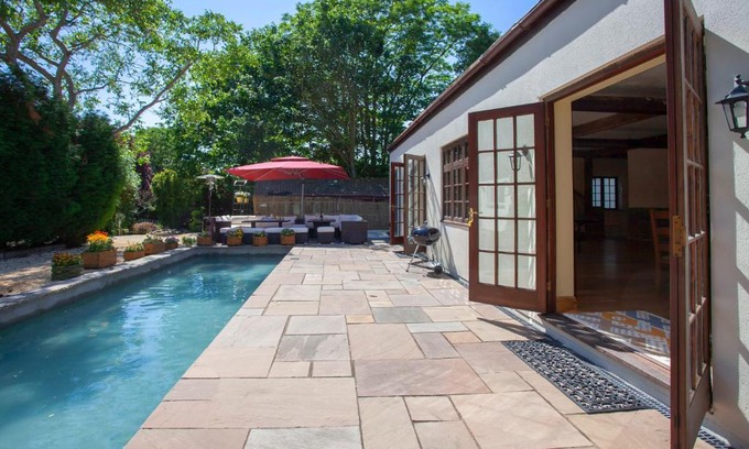 Olveston Villa | Experience La Villa Olli: Natural Pool & Inviting Hot Tub