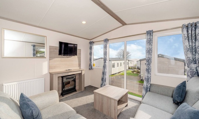 Otterton House | Stylish 12ft-Wide Caravan with Oceanfront Views & Spa