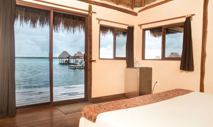Mario Villanueva Madrid Cabin | Cozy Lagoon Front Suite with Bikes, Kayaks & Spa Access