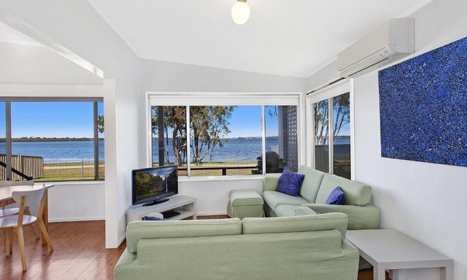 Buff Point House | Pet-Friendly Lake Edge Cottage with Oceanfront Views