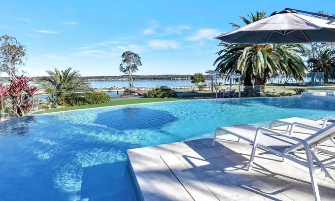 Dora Creek House | Waterfront Lake Palm Resort: Rated 10/10 with Private Pool