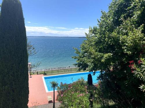 Padenghe sul Garda Apartment | Serene Lake View Apartment with Pool and Private Beach