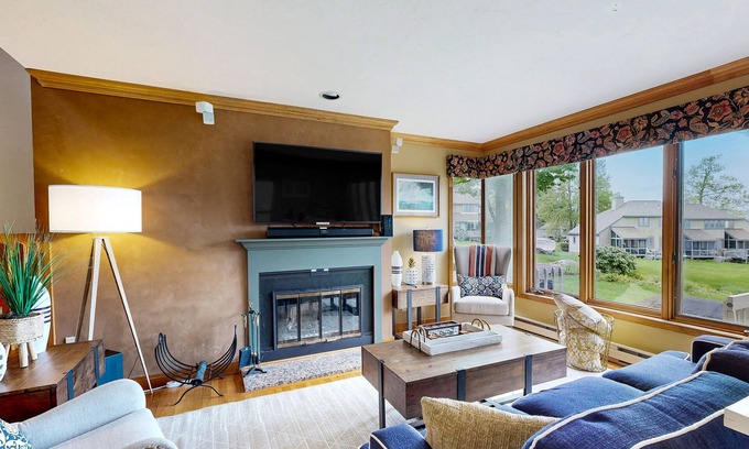 Gilford House | Lakefront Townhome with Pools, Tennis & Cozy Fireplace