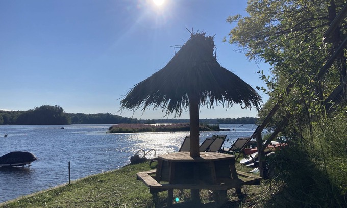 Newaygo Cottage | Lakefront Cottage with Private Beach & Top Amenities Await