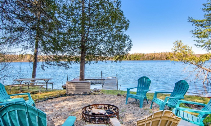 Presque Isle Cabin | Pet-Friendly Lakefront Retreat with Dock & Firepit