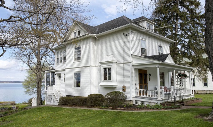 Town of Ledyard House | Idyllic Lakefront Home in Aurora with Stunning Ocean Views