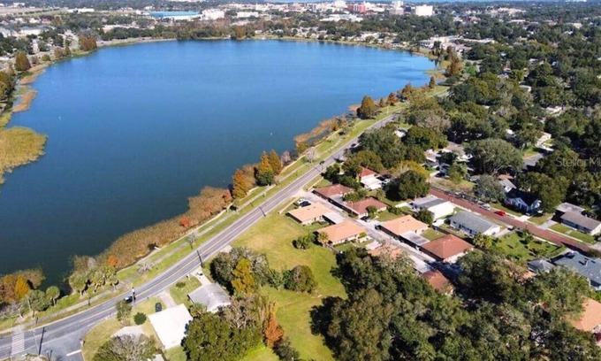 Dixieland House | Lakefront Retreat with Pool and Kitchen Near Attractions