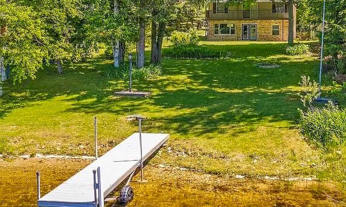 Johannesburg House | Lakefront home with large yard, dock, gas grill, WIFI near golf & ATV trails!