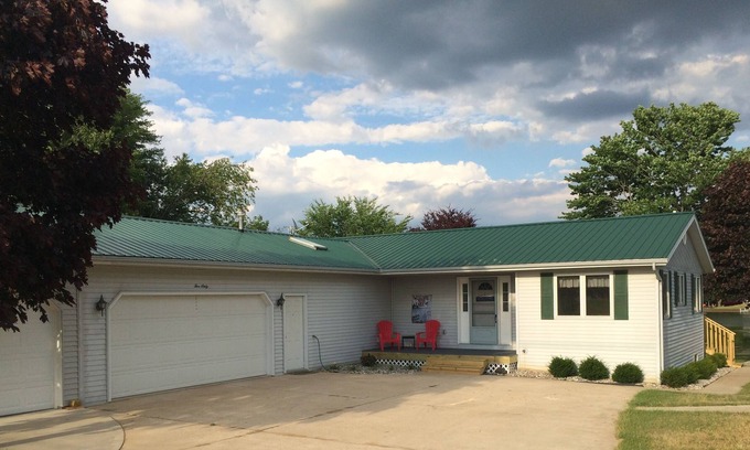 Gladwin House | Lakefront Home With Large Private Yard, Sandy Beach, Kayak and Rowboat Included.