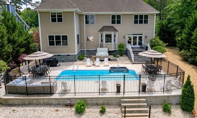 Halifax County House | 🌅 Lakefront Luxury | Flat Lot, Heated Pool, Hot Tub & Game Room Fun 🎮 Dock!