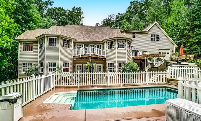 Mineral House | Lakefront with pool, hot tub, dock, SUPs, water carpet, billiards, foosball, gym