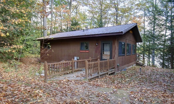 Lac du Flambeau Cabin | Pet-Friendly Lakeside Cabin with Private Dock & Hot Tub