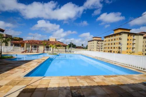Coqueiro Apartment | Poolside Retreat: Apt. Mello 2/4 with Free Wifi